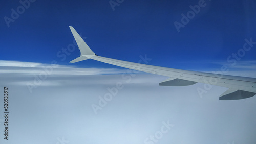 View from an Airplane during flight with clouds