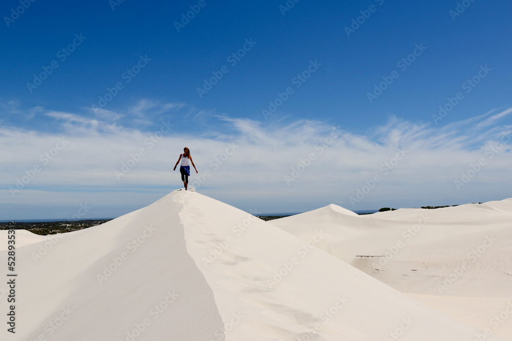 Girl in white dunes