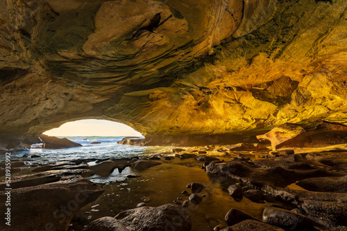 Image Number A1RT48030-HDR. An eerie view taken from the back of Waenhuiskrans sea-cave towards the mouth of the cave and the sea. Arniston. Overberg.  Western Cape. South Africa photo