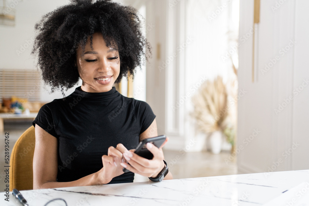 a woman prints a message using a phone in the hands of a pi a woman prints a message using a phone in the hands of a pi