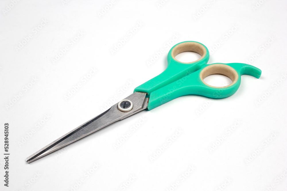 Green tosca scissors isolated on white background. Green tosca scissors isolated on white background.