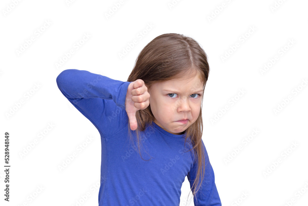 Kid holding thumb finger down with funny face on white background caucasian little girl of 5 years in blue waist up Kid holding thumb finger down with funny face on white background caucasian little girl of 5 years in blue waist up