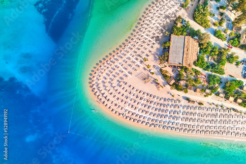 Aerial view of sea bay with sandy beach at sunny day in summer. Drone photo of Blue lagoon in Oludeniz, Turkey