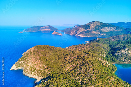 Aerial view of mediterranean azure sea with mountain island