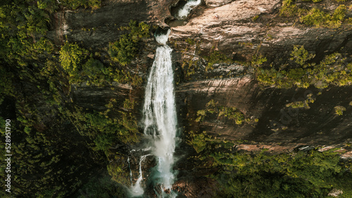 Natural Landscape with a huge waterfall from the mountains, green hills and jungle, Diyaluma in Sri Lanka. photo