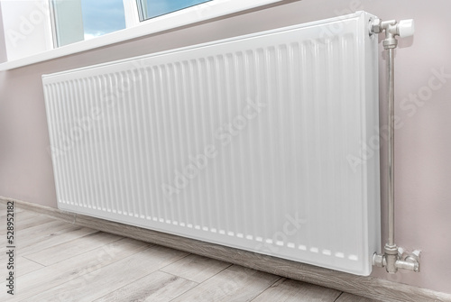 Wallpaper Mural Modern radiator under the window. Heat and economy. Torontodigital.ca