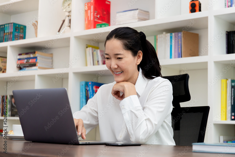 © panitan - woman work using computer hand typing laptop keyboard contact us.student study learning education online.adult professional people chatting search at office.concept for technology device business