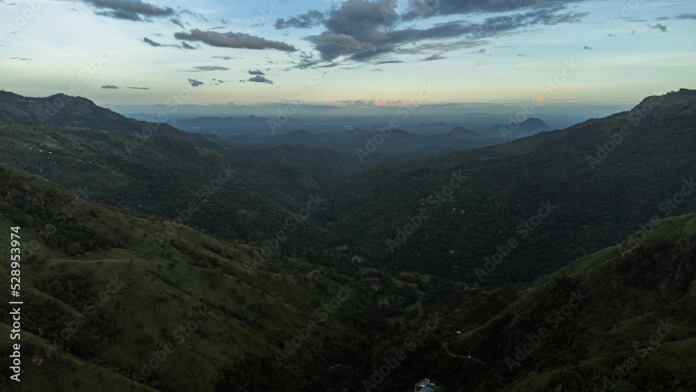 Beautiful mountain landscape with green mountains and blue sky.