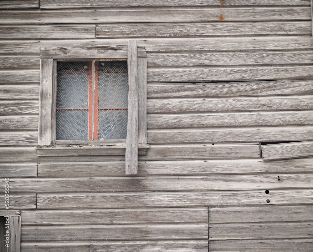Old unpainted wall with window Old unpainted wall with window
