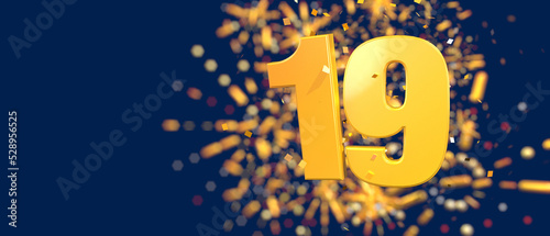 Gold number 19 in the foreground with gold confetti falling and fireworks behind out of focus