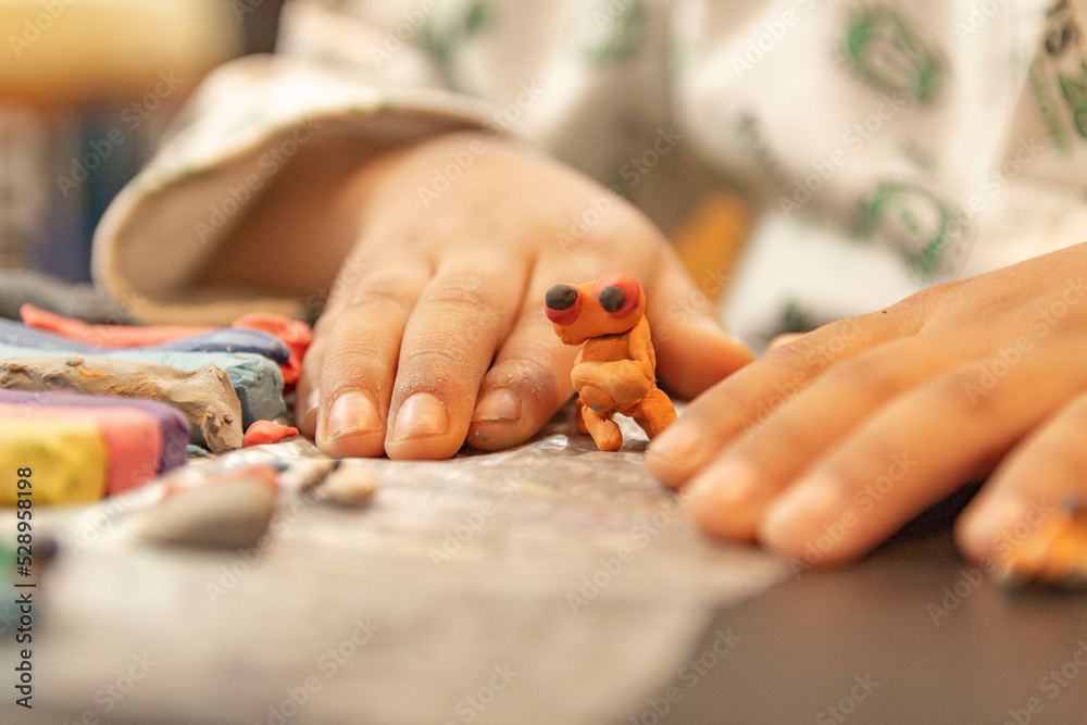 Naklejka premium plasticine figure molded by child's hands