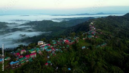 Bird's eye view of rural houses on green hills of Sajek Valley in Bangladesh photo