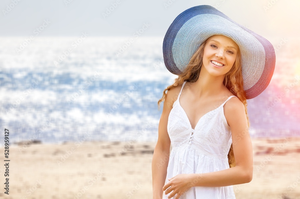 Young happy woman enjoying the resort on the beach Young happy woman enjoying the resort on the beach