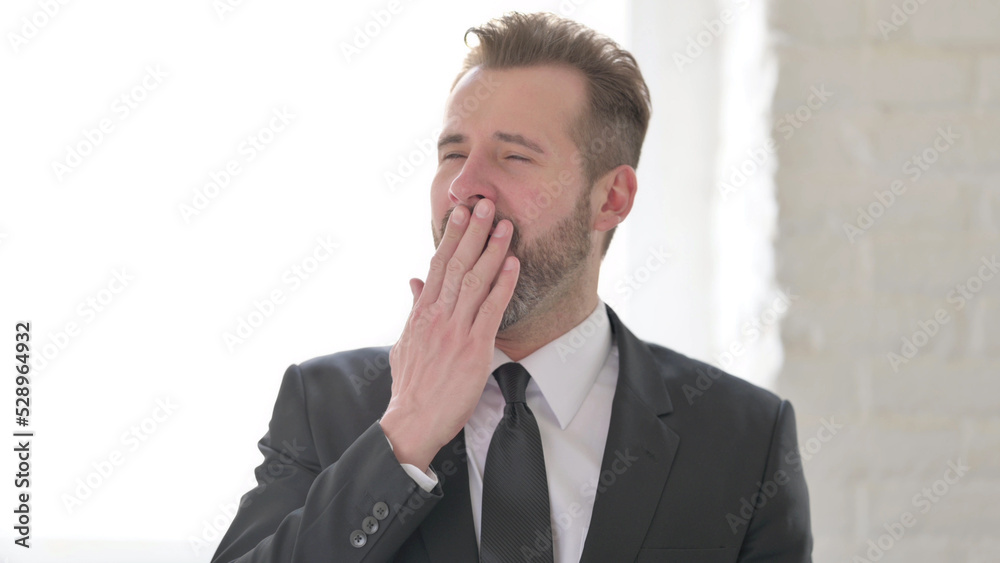 Middle Aged Businessman Feeling Sleepy, Yawning Middle Aged Businessman Feeling Sleepy, Yawning