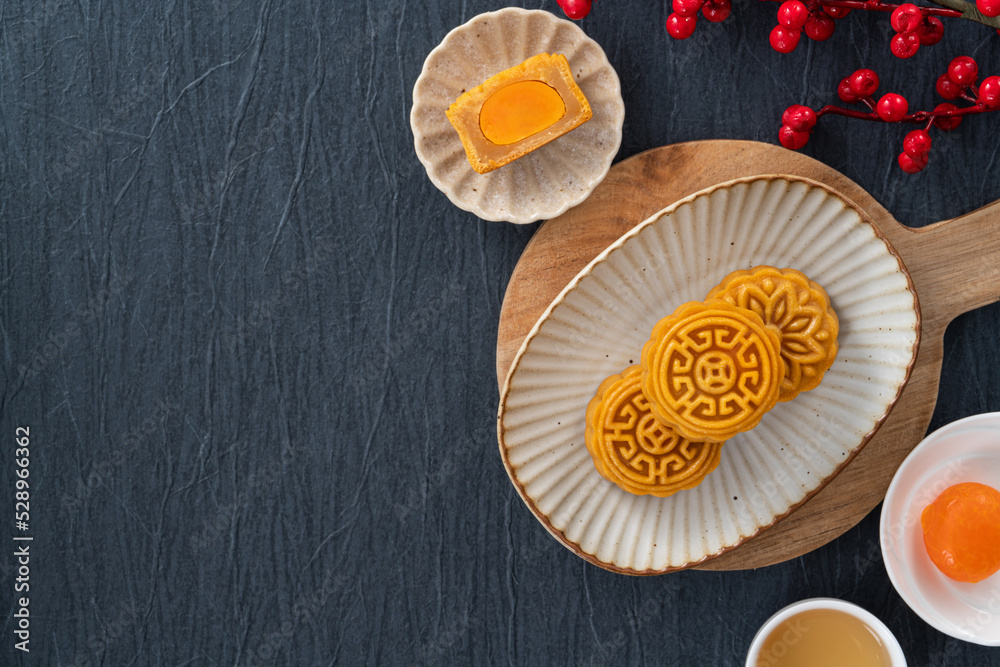 Delicious Cantonese moon cake for Mid-Autumn Festival food mooncake on blue table background. Delicious Cantonese moon cake for Mid-Autumn Festival food mooncake on blue table background.