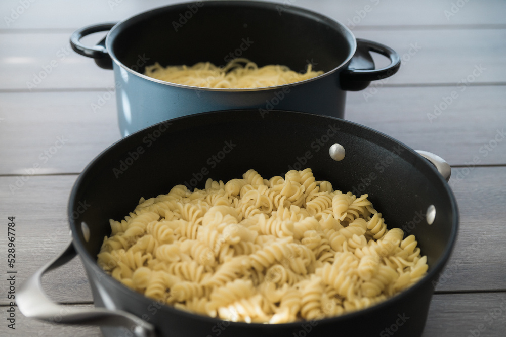 Freshly prepared pasta in pot ready to serve Freshly prepared pasta in pot ready to serve