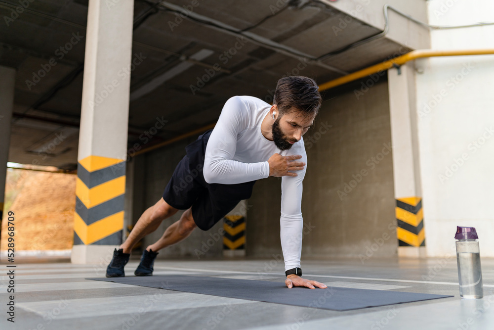 Fototapeta premium athletic strong hansome man on morning fitness workout exercise
