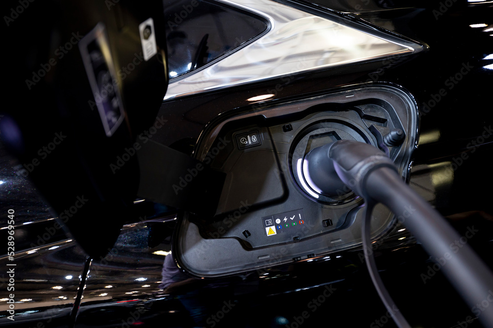 Electric car plugged in Electric car plugged in