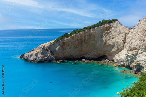 The magnificent Porto Katsiki beach on Lefkada Island, Greece. Beautiful landscape with sea coast, swimming people, trees, azure water.