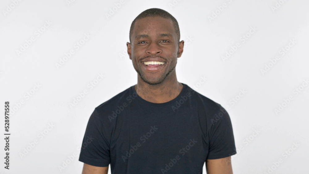 Young African Man Smiling at Camera on White Background Young African Man Smiling at Camera on White Background