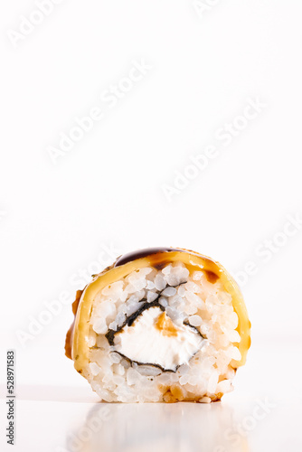 Sushi roll isolated on white background. California sushi roll with tuna, vegetables
