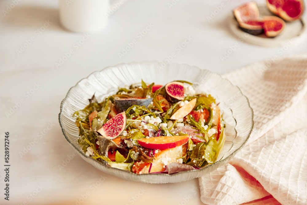 Fresh autumn salad with fresh arugula, grain cheese, batata and figs. Healthy appetizer, fresh vegan salad Fresh autumn salad with fresh arugula, grain cheese, batata and figs. Healthy appetizer, fresh vegan salad