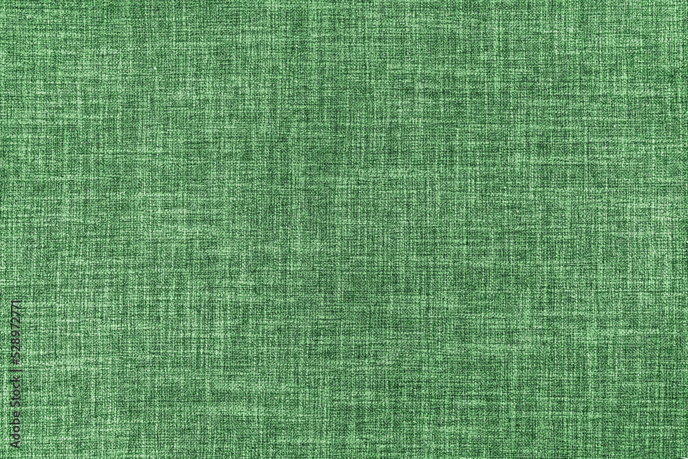 Fototapeta premium Texture of natural upholstery fabric or cloth. Fabric texture of natural cotton or linen textile material. Green canvas background. Decorative fabric for curtain, furniture, walls, clothes
