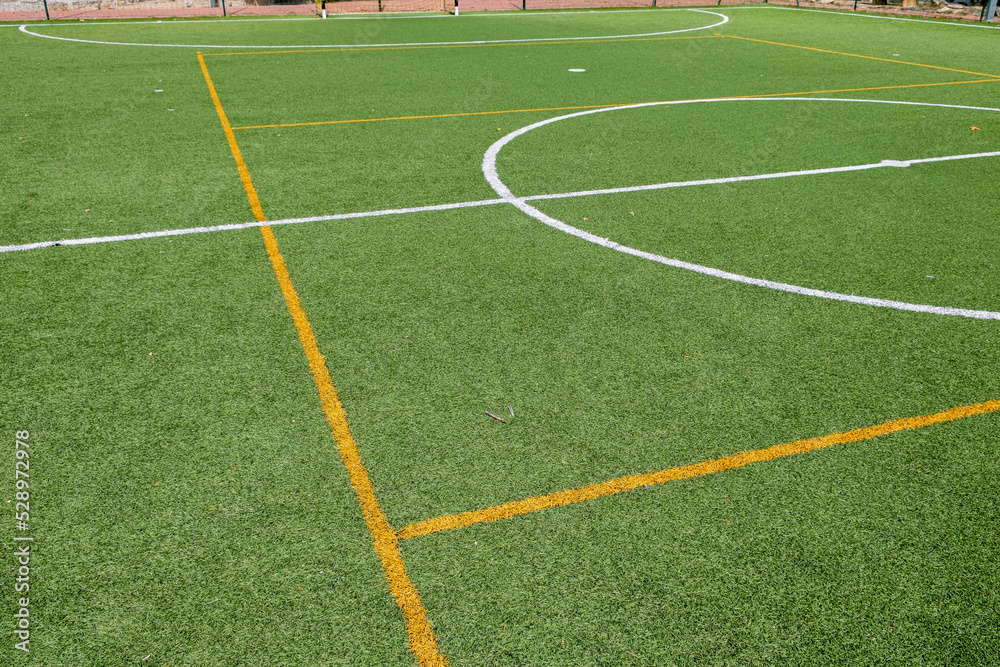 Obraz premium artificial grass soccer field, central part