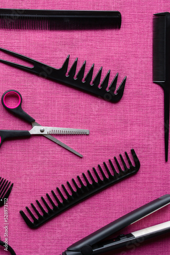 hairdresser set of different objects on pink background