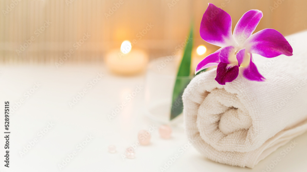 Still life spa setting with pink stone aroma scent candle and plumeria flower. Thai spa massage. Spa treatment cosmetic beauty. Aromatherapy care relax wellness. Aroma and salt scrub healthy lifestyle Still life spa setting with pink stone aroma scent candle and plumeria flower. Thai spa massage. Spa treatment cosmetic beauty. Aromatherapy care relax wellness. Aroma and salt scrub healthy lifestyle
