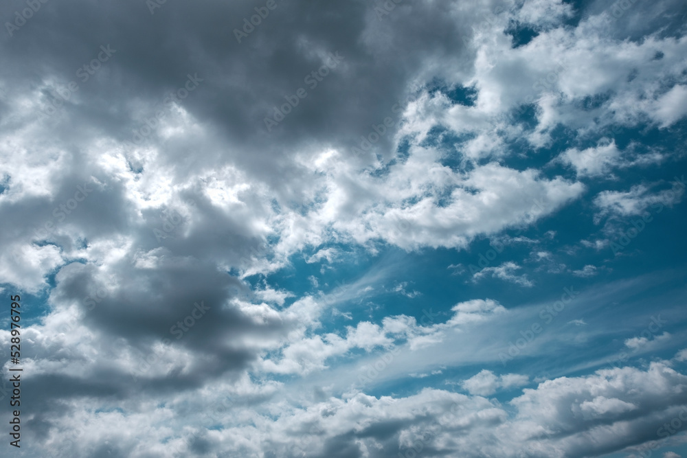 Texture of a blue sky with gray clouds