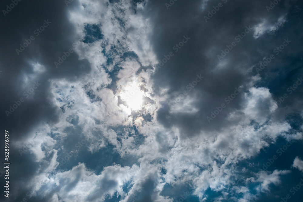 Fototapeta premium Texture of a blue sky with gray clouds