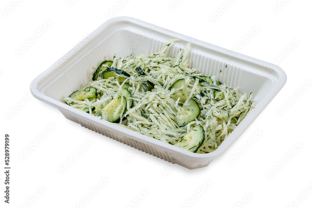 Salad with fresh cucumbers and grated cheese. In a plastic container. Food to go. On a light background. Salad with fresh cucumbers and grated cheese. In a plastic container. Food to go. On a light background.