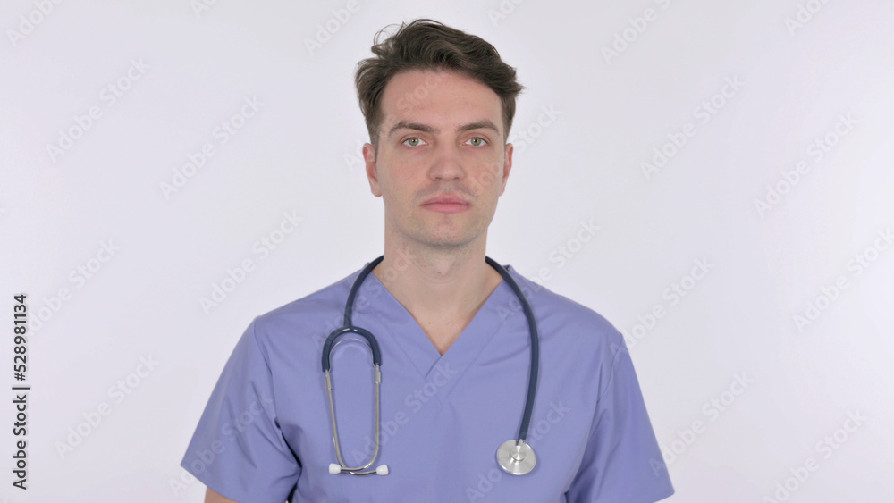 Serious Young Doctor Looking at the Camera on White Background Serious Young Doctor Looking at the Camera on White Background