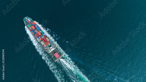 cargo container ship top view carrying container and running for export  goods  from  cargo yard port to other ocean concept freight shipping ship logistics transportation business service concept © Yellow Boat