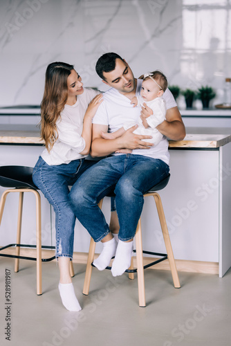 Young Family in the kitchen have great time