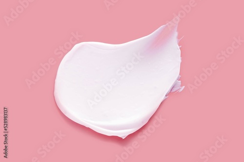 Face or body cream hair balm strawberry pink background
