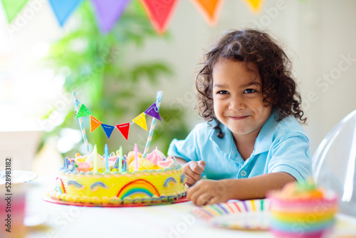 Photography Kids birthday party. Children with cake and gifts