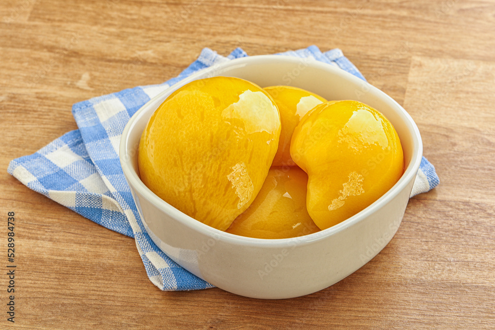 Sweet canned peaches with syrope Sweet canned peaches with syrope