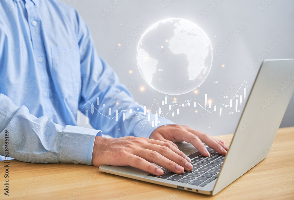 business finance technology or entrepreneur concept. Asian man using a laptop communicates and work or investment stock market on internet or work with customer in home background business finance technology or entrepreneur concept. Asian man using a laptop communicates and work or investment stock market on internet or work with customer in home background