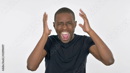 Young African Man Shouting and Screaming on White Background