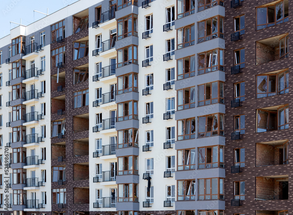 Broken windows of residential civilian building after Russian rocket exploded during Russian war against Ukraine. Broken glass windows, broken window frames from explosion. Russian invasion concept Broken windows of residential civilian building after Russian rocket exploded during Russian war against Ukraine. Broken glass windows, broken window frames from explosion. Russian invasion concept