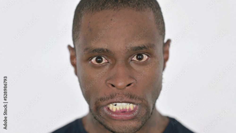 Fototapeta premium Face Close Up of Angry Young African Man
