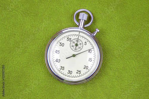 mechanical analog stopwatch on a colored background. Time part precision. Measurement of the speed interval