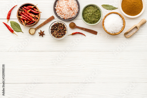 Assortment of cooking flavor - spices and herbs in bowls, top view