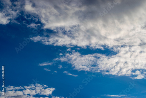 Fantastic soft white clouds against blue sky background. © Ruslan