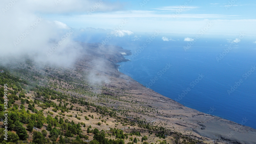 El Hierro coast with mountains and sea from drone on foggy day