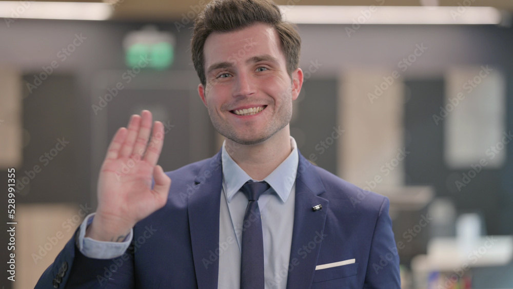 Portrait of Businessman Waving, Welcoming Portrait of Businessman Waving, Welcoming
