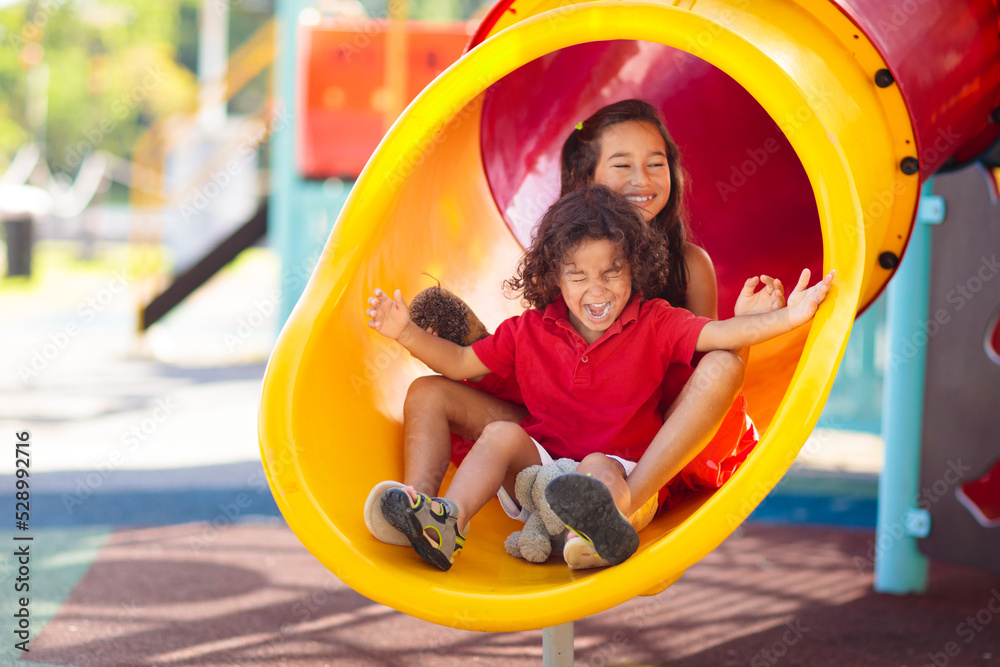 Kids on playground. Children on school yard slide. Kids on playground. Children on school yard slide.