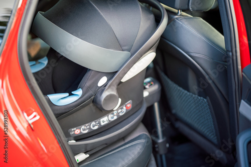 Isofix connection standard to fasten childrens carseat to car interior. Safety and transport concept. photo
